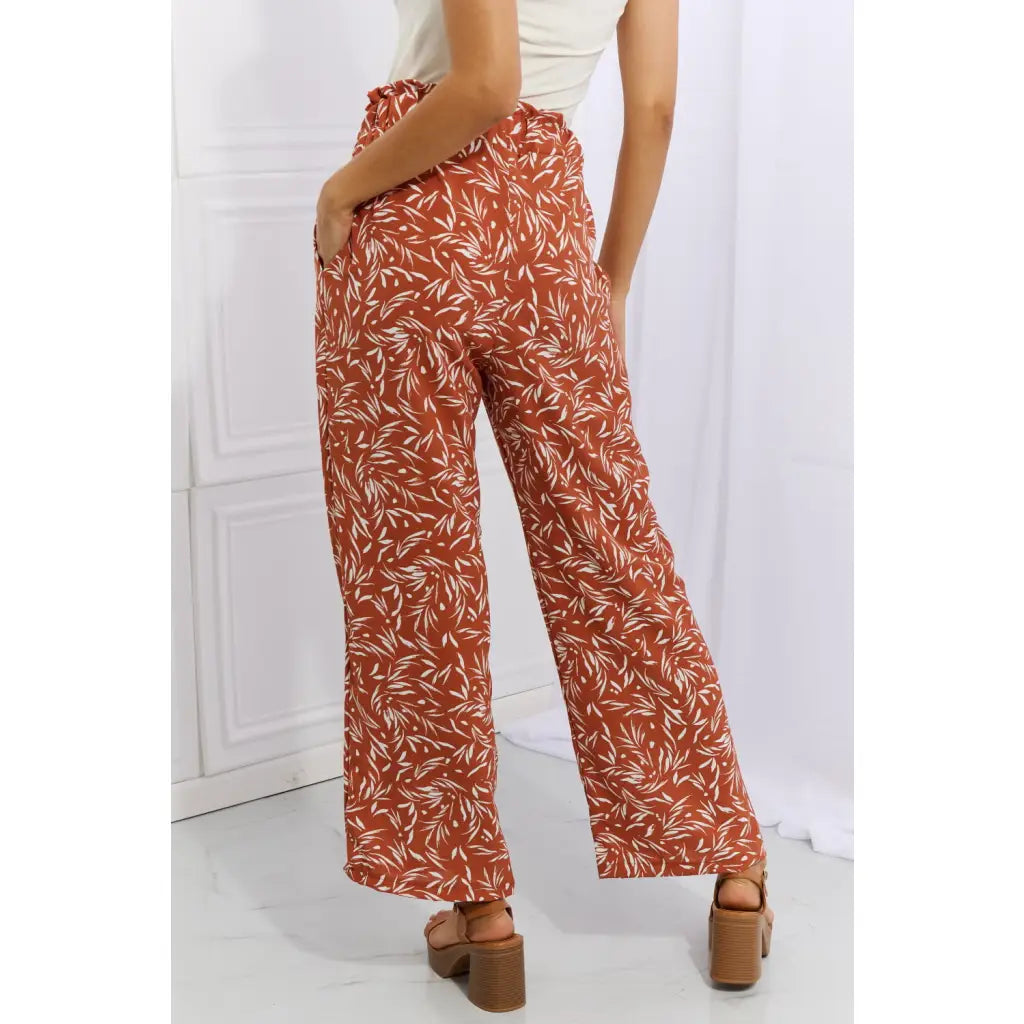 These trendy geometric print paperbag pants are made from a beautifully soft high quality fabric. The elastic waistband