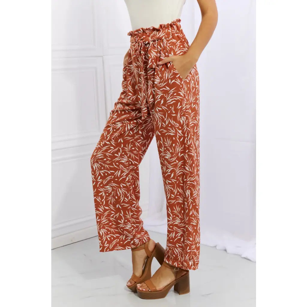 These trendy geometric print paperbag pants are made from a beautifully soft high-quality fabric. The elastic waistband