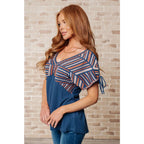Get ready to strike a stylish pose with our Greece Lightning V-Neck Blouse! Made from comfortable jersey knit
