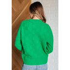 Our Green on Checked Sweater is a playful pullover made with cozy knit material. It features round ribbed neckline long