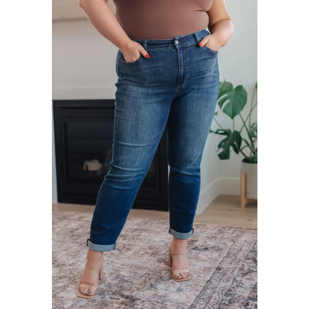 Dark wash Judy Blue slim fit jeans with 4-way stretch mid-rise and optional cuff. Size inclusive from 0–24W