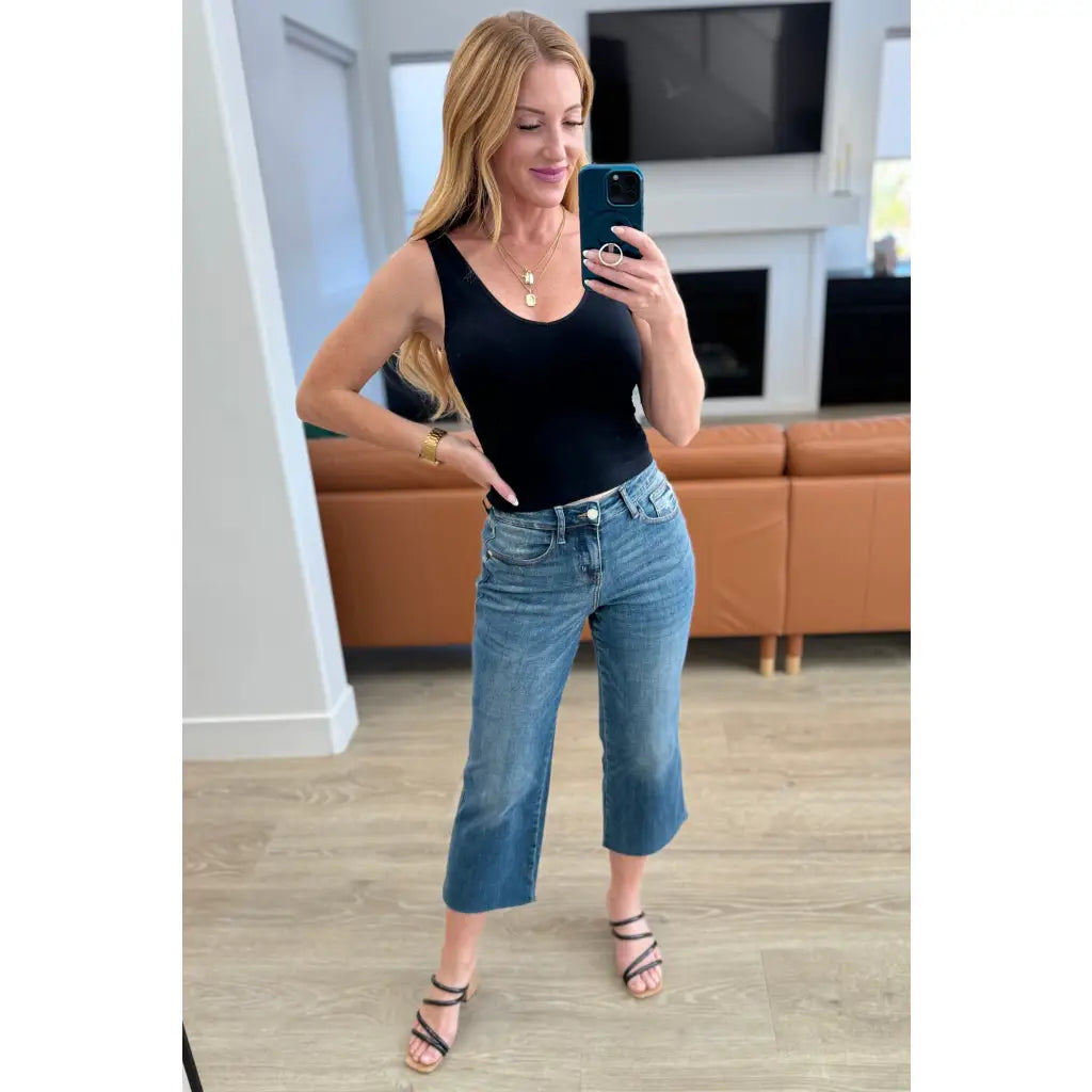 Discover effortless style with our Hayes High Rise Wide Leg Crop Jeans. This medium wash 4-way stretch denim is cut