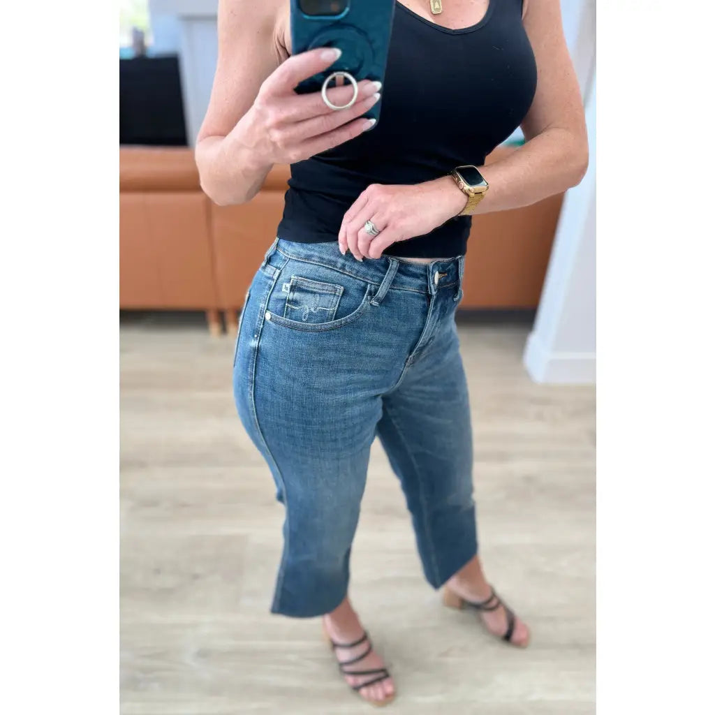 Discover effortless style with our Hayes High Rise Wide Leg Crop Jeans. This medium wash 4-way stretch denim is cut