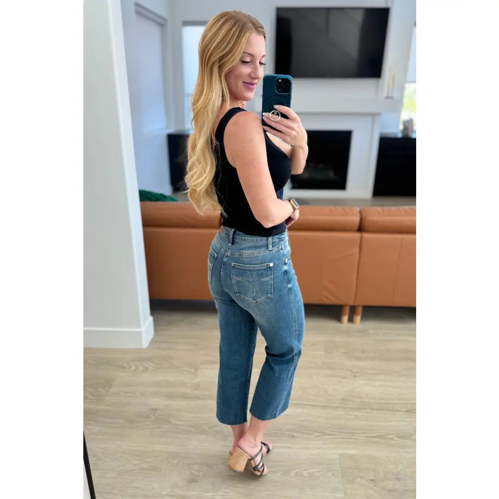 Discover effortless style with our Hayes High Rise Wide Leg Crop Jeans. This medium wash 4-way stretch denim is cut