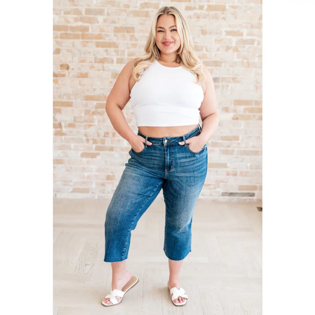 Discover effortless style with our Hayes High Rise Wide Leg Crop Jeans. This medium wash 4-way stretch denim is cut