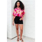 Unleash your inner cosmic queen with our Hazy Cosmic Jive Relaxed Blouse. Made luxurious poly satin this blouse