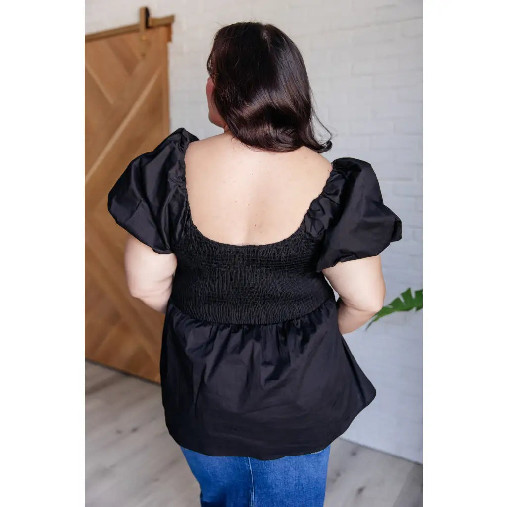 Upgrade your wardrobe with our Her Favorite Records Balloon Sleeve Blouse! Featuring a classic black woven fabric