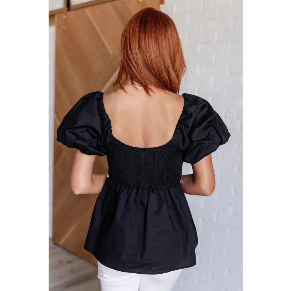 Upgrade your wardrobe with our Her Favorite Records Balloon Sleeve Blouse! Featuring a classic black woven fabric