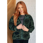 Our High Perspective Geometric Fleece Jacket! Made with green and black soft polar fleece featuring a snap front