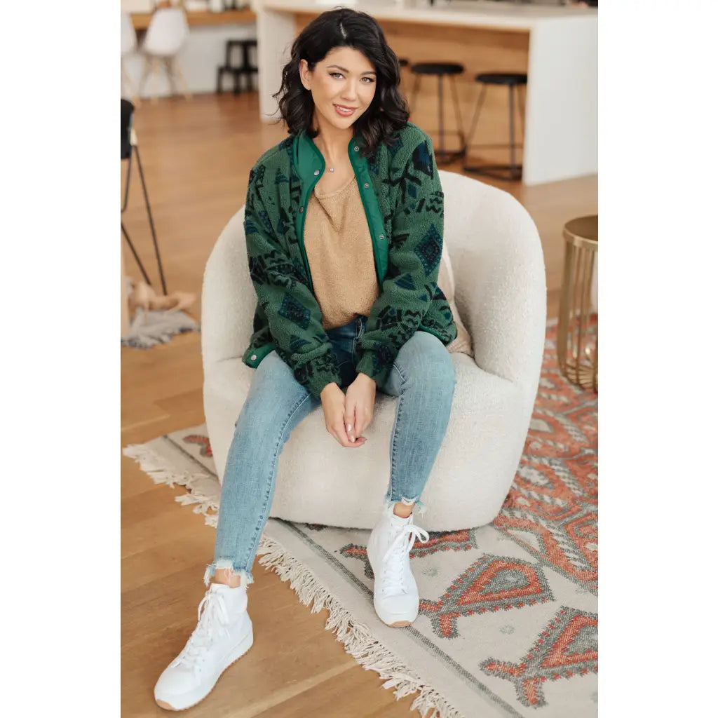 Our High Perspective Geometric Fleece Jacket! Made with green and black soft polar fleece featuring a snap front