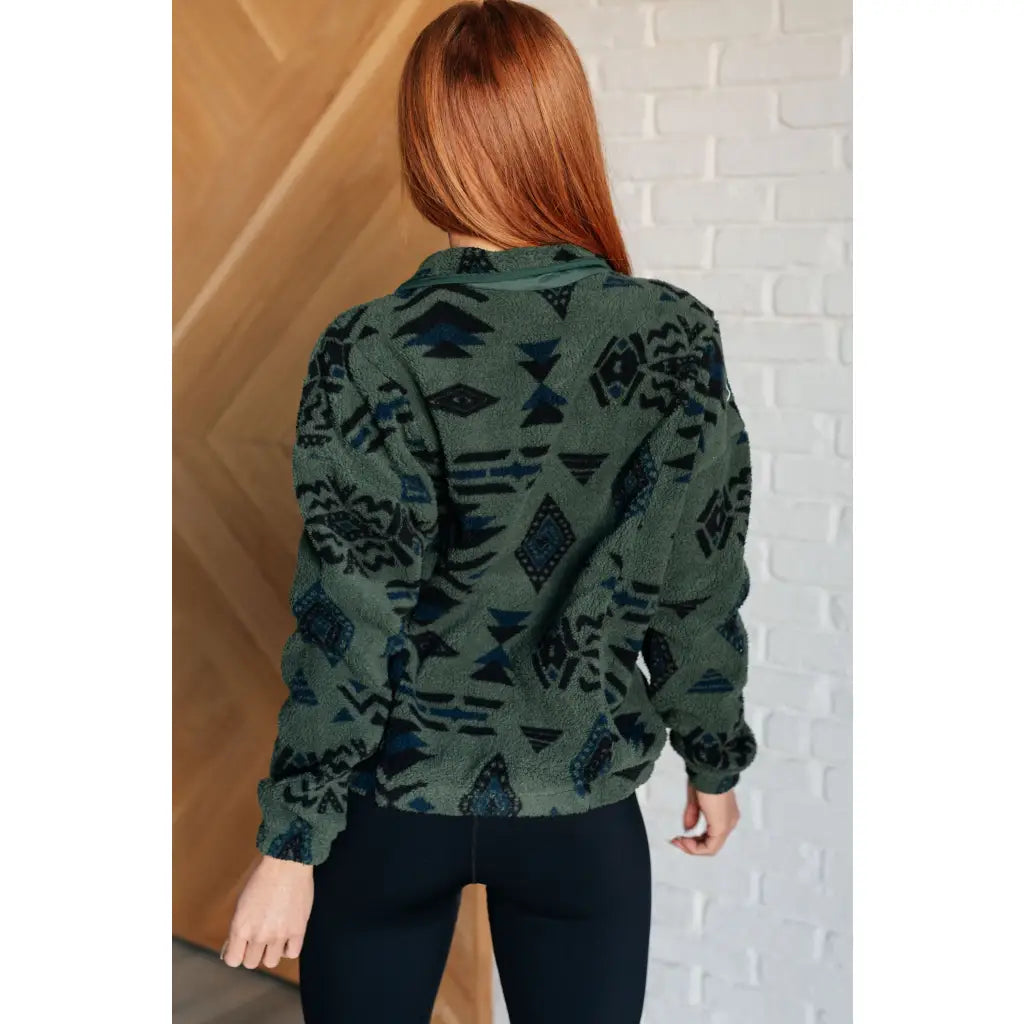 Our High Perspective Geometric Fleece Jacket! Made with green and black soft polar fleece featuring a snap front