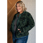 Our High Perspective Geometric Fleece Jacket! Made with green and black soft polar fleece featuring a snap front