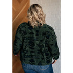 Our High Perspective Geometric Fleece Jacket! Made with green and black soft polar fleece featuring a snap front