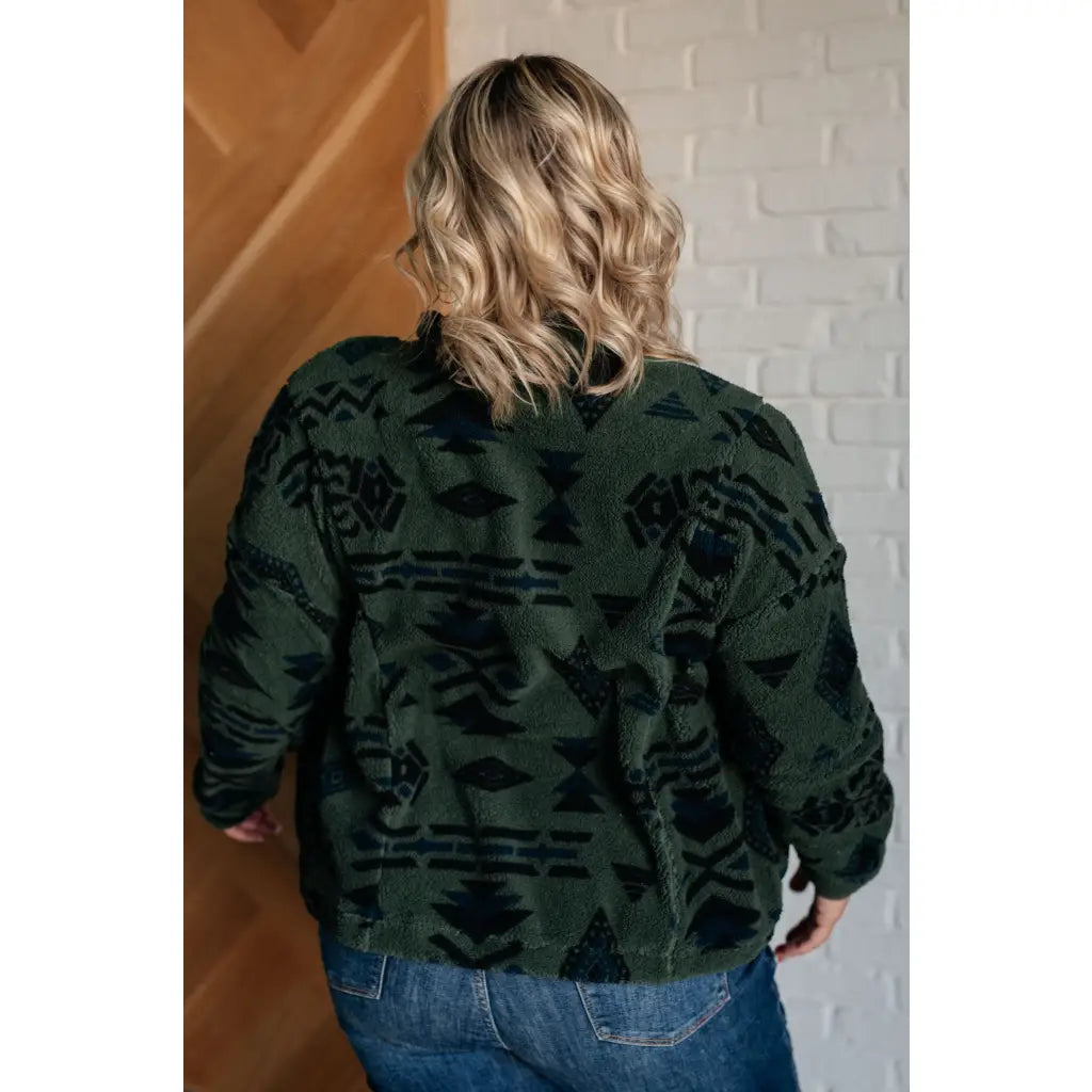 Our High Perspective Geometric Fleece Jacket! Made with green and black soft polar fleece featuring a snap front