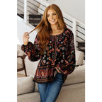 Our I Feel That Peasant Blouse is beautifully textured with a lightweight woven black fabric features tie-neck keyhole