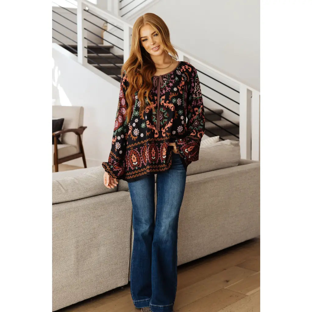 Our I Feel That Peasant Blouse is beautifully textured with a lightweight woven black fabric features tie-neck keyhole