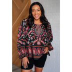 Our I Feel That Peasant Blouse is beautifully textured with a lightweight woven black fabric features tie-neck keyhole