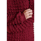 Our In Denial Bubble Pullover Top in Maroon will elevate any wardrobe! Showcase your trendy style with the shoulder