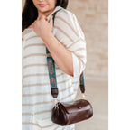 Our In the Barrel Crossbody Bag is perfect accessory! Made with faux leather and gold toned hardware its gorgeous