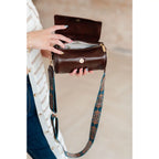 Our In the Barrel Crossbody Bag is perfect accessory! Made with faux leather and gold toned hardware its gorgeous