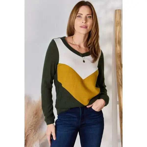 Our Invested Color Block V-Neck Top is stylish and contemporary! Featuring trendy contrasting blocks of color long