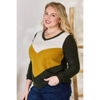 Our Invested Color Block V-Neck Top is stylish and contemporary! Featuring trendy contrasting blocks of color long