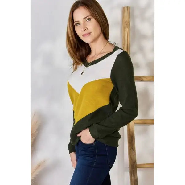 Our Invested Color Block V-Neck Top is stylish and contemporary! Featuring trendy contrasting blocks of color long