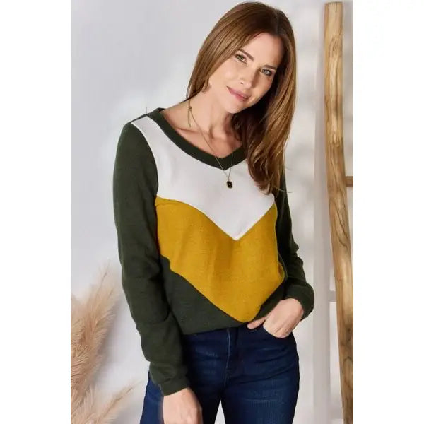 Our Invested Color Block V-Neck Top is stylish and contemporary! Featuring trendy contrasting blocks of color long