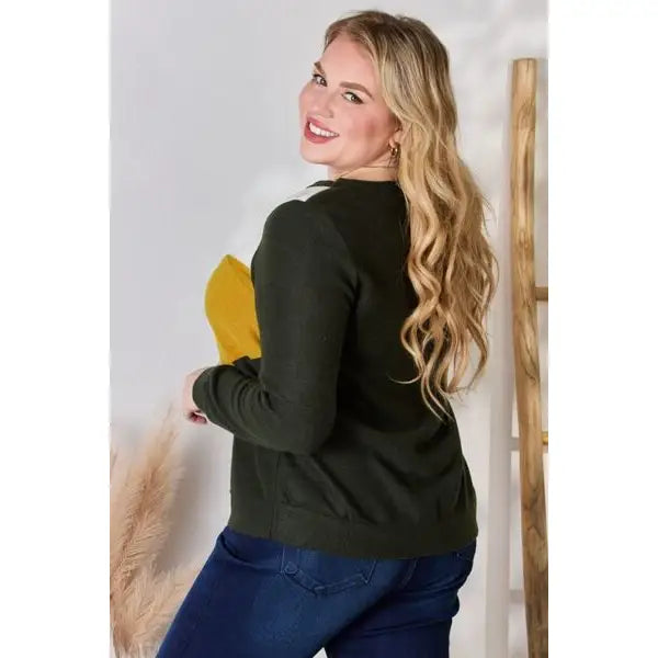 Our Invested Color Block V-Neck Top is stylish and contemporary! Featuring trendy contrasting blocks of color long