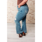 Our Isla Mid Rise Distressed Released Hem Bootcut Judy Blue Jeans! are the ultimate in comfort Figure flattering