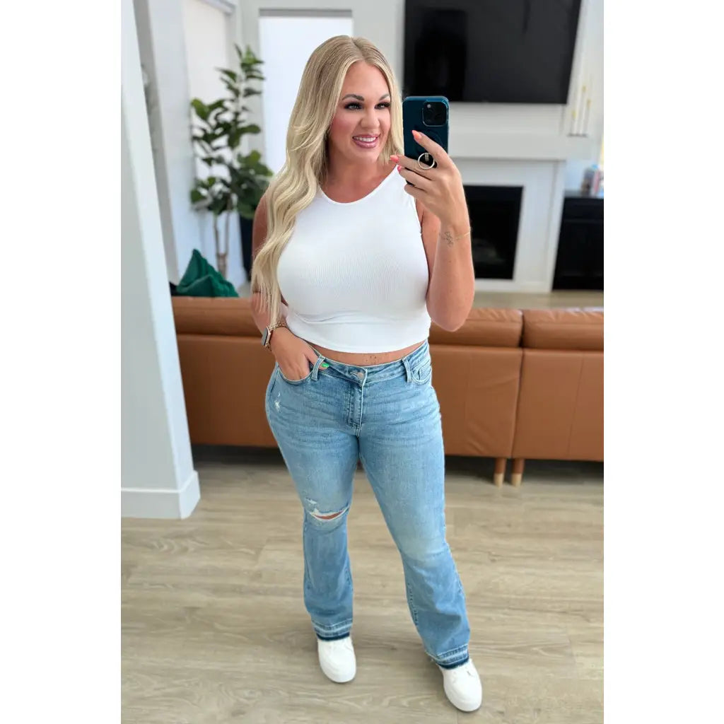 Our Isla Mid Rise Distressed Released Hem Bootcut Judy Blue Jeans! are the ultimate in comfort Figure flattering