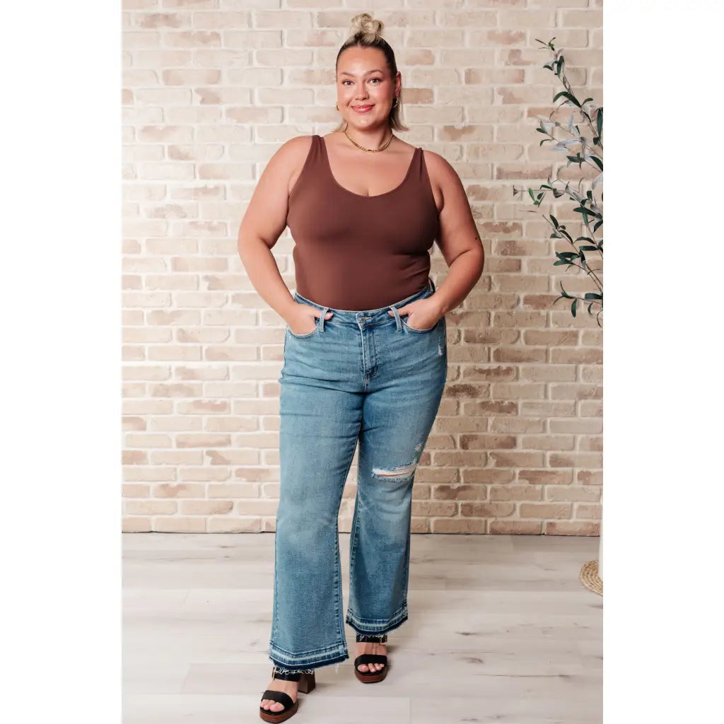 Our Isla Mid Rise Distressed Released Hem Bootcut Judy Blue Jeans! are the ultimate in comfort Figure flattering