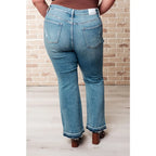 Our Isla Mid Rise Distressed Released Hem Bootcut Judy Blue Jeans! are the ultimate in comfort Figure flattering