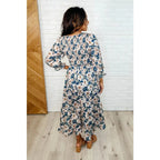 Our Ivory Petals Smocked Midi Dress features a beautiful floral print on navy background. This romantic dress is must