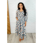 Our Ivory Petals Smocked Midi Dress features a beautiful floral print on navy background. This romantic dress is must