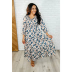 Our Ivory Petals Smocked Midi Dress features a beautiful floral print on navy background. This romantic dress is must