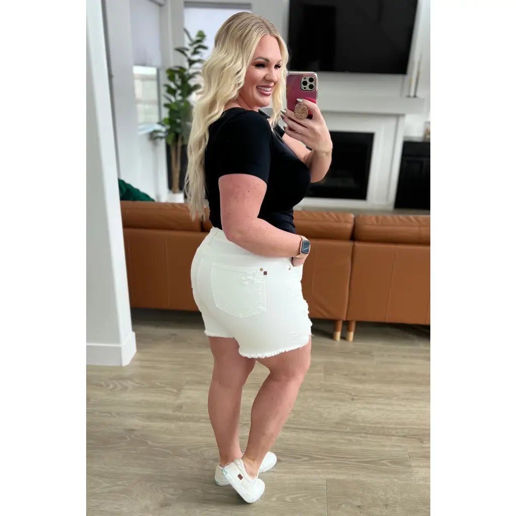 Rock a vintage - inspired look with our Jessie High Rise Rigid Magic Cutoff Shorts in white. The high rise waist