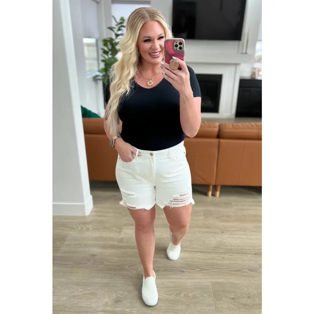 Rock a vintage - inspired look with our Jessie High Rise Rigid Magic Cutoff Shorts in white. The high rise waist