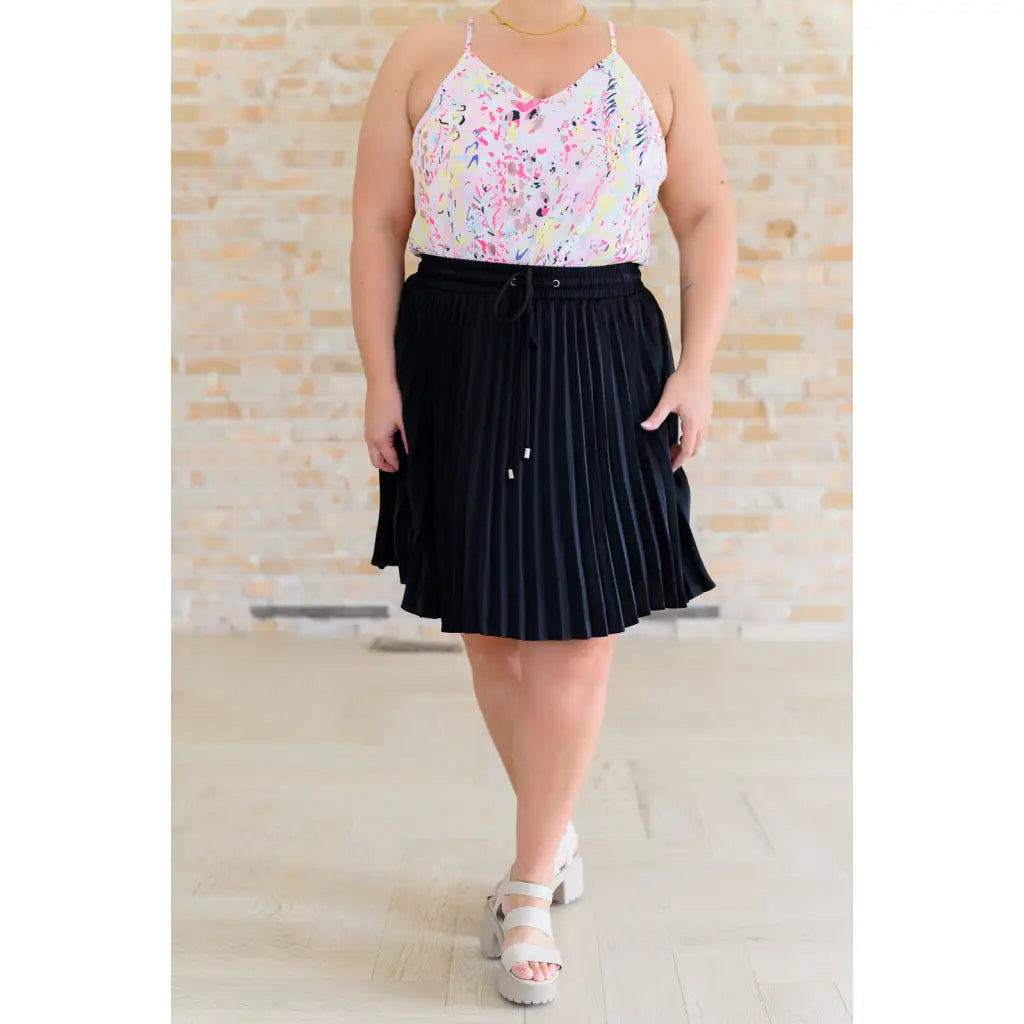 This gorgeous skirt is crafted from a black poly satin with an ultra-luxe feel. knee length high-waisted accordion