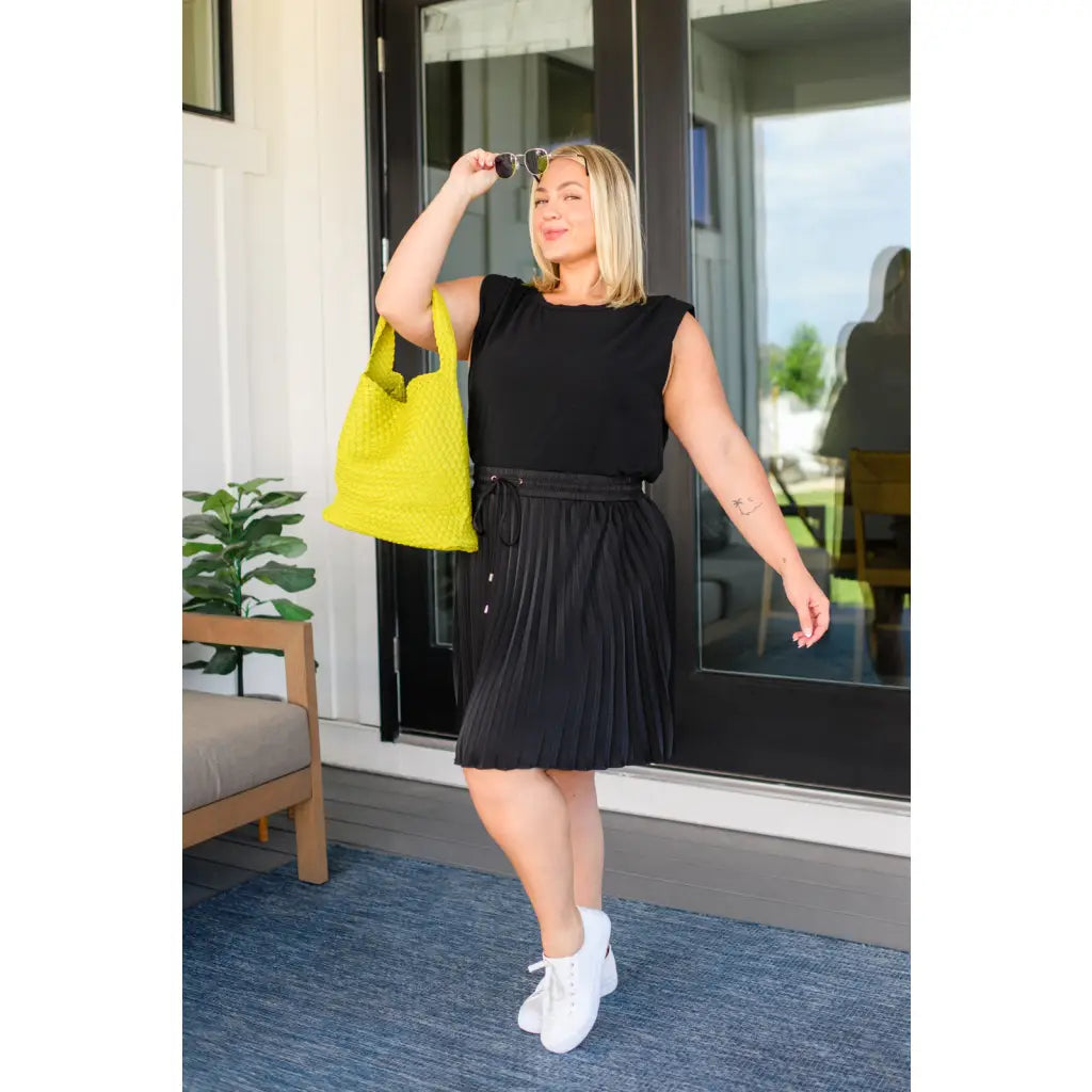 This gorgeous skirt is crafted from a black poly satin with an ultra-luxe feel. knee length high-waisted accordion