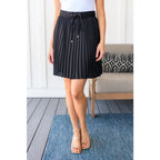 This gorgeous skirt is crafted from a black poly satin with an ultra-luxe feel. knee length high-waisted accordion