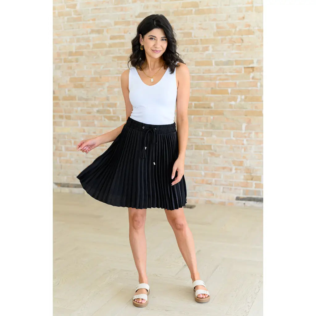 This gorgeous skirt is crafted from a black poly satin with an ultra-luxe feel. knee length high-waisted accordion