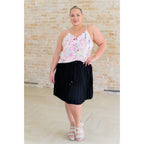 This gorgeous skirt is crafted from a black poly satin with an ultra-luxe feel. knee length high-waisted accordion