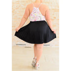 This gorgeous skirt is crafted from a black poly satin with an ultra-luxe feel. knee length high-waisted accordion