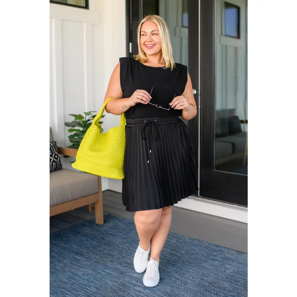 This gorgeous skirt is crafted from a black poly satin with an ultra-luxe feel. knee length high-waisted accordion