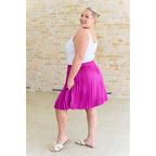 This gorgeous skirt is crafted from a magenta poly satin with an ultra-luxe feel. knee length high-waisted accordion