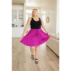 This gorgeous skirt is crafted from a magenta poly satin with an ultra-luxe feel. knee length high-waisted accordion