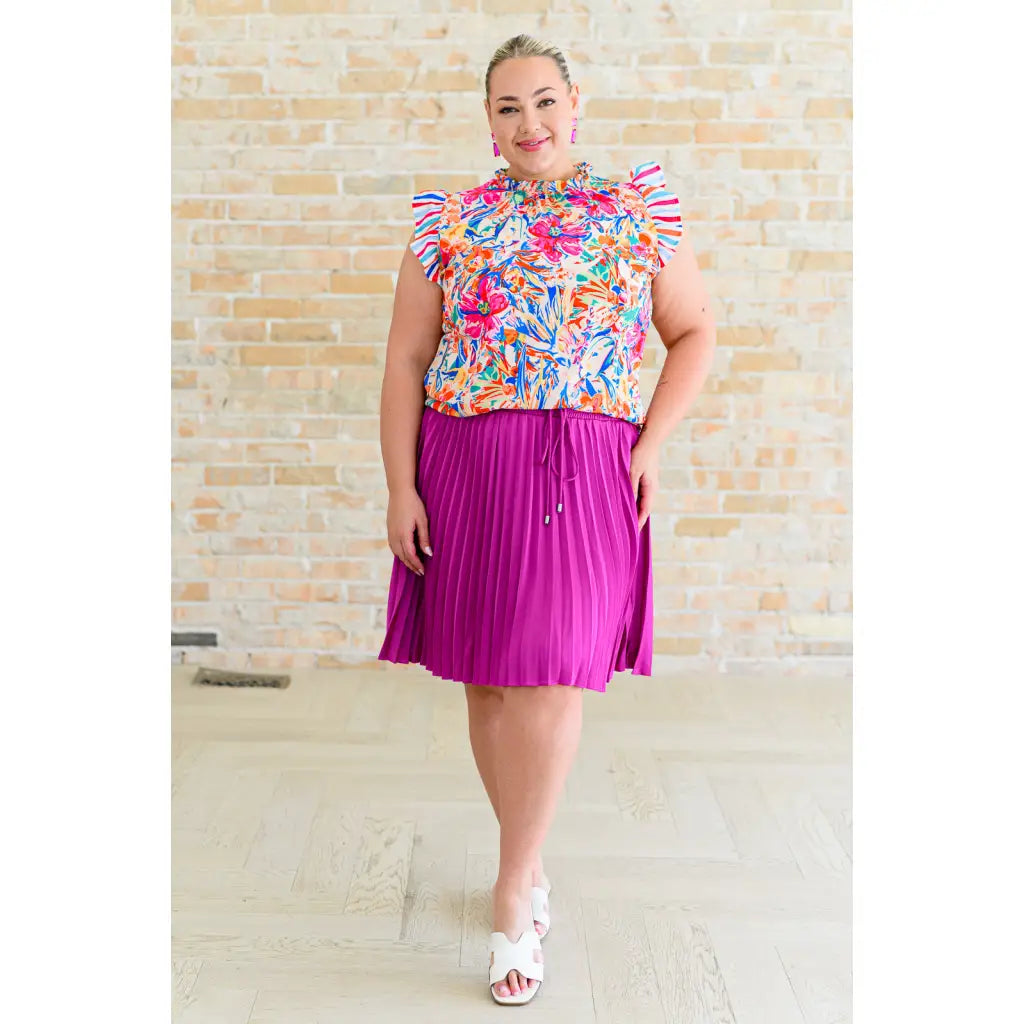 This gorgeous skirt is crafted from a magenta poly satin with an ultra-luxe feel. knee length high-waisted accordion