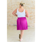 This gorgeous skirt is crafted from a magenta poly satin with an ultra-luxe feel. knee length high-waisted accordion