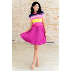 This gorgeous skirt is crafted from a magenta poly satin with an ultra-luxe feel. knee length high-waisted accordion